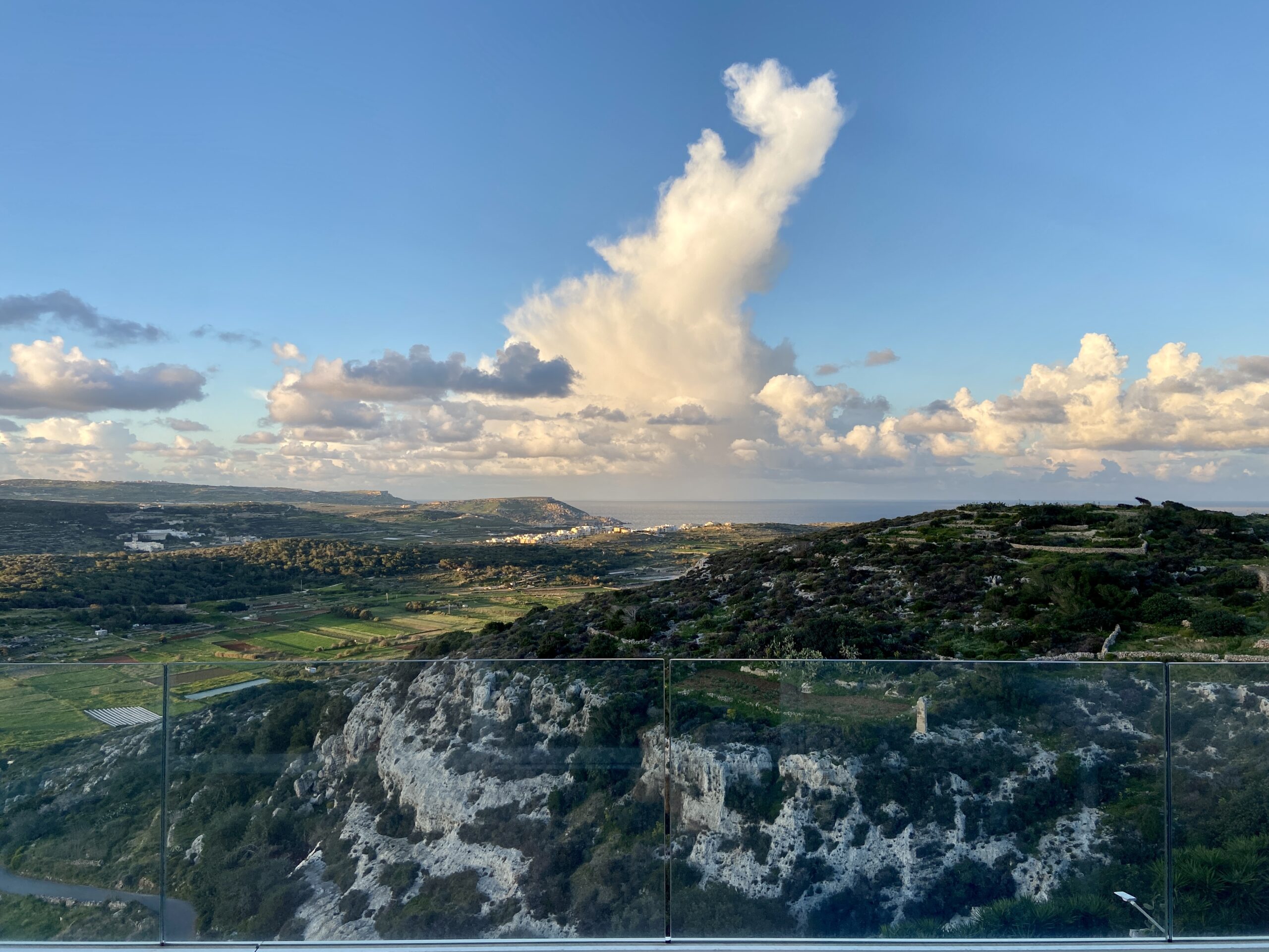 Photo showing the view from apartment terrace which includes a valley and sea views.
